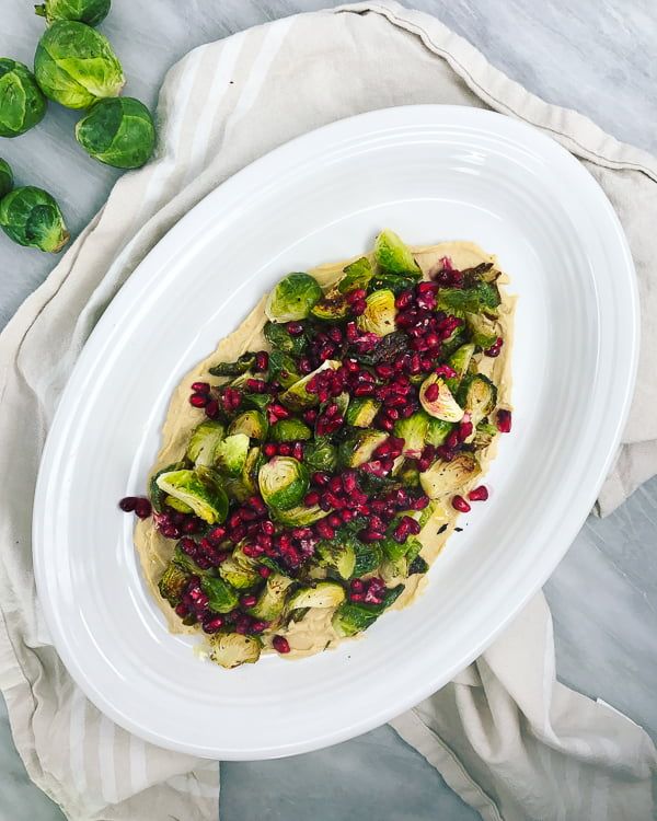 Crispy Brussels Sprouts with Pomegranate & Hummus