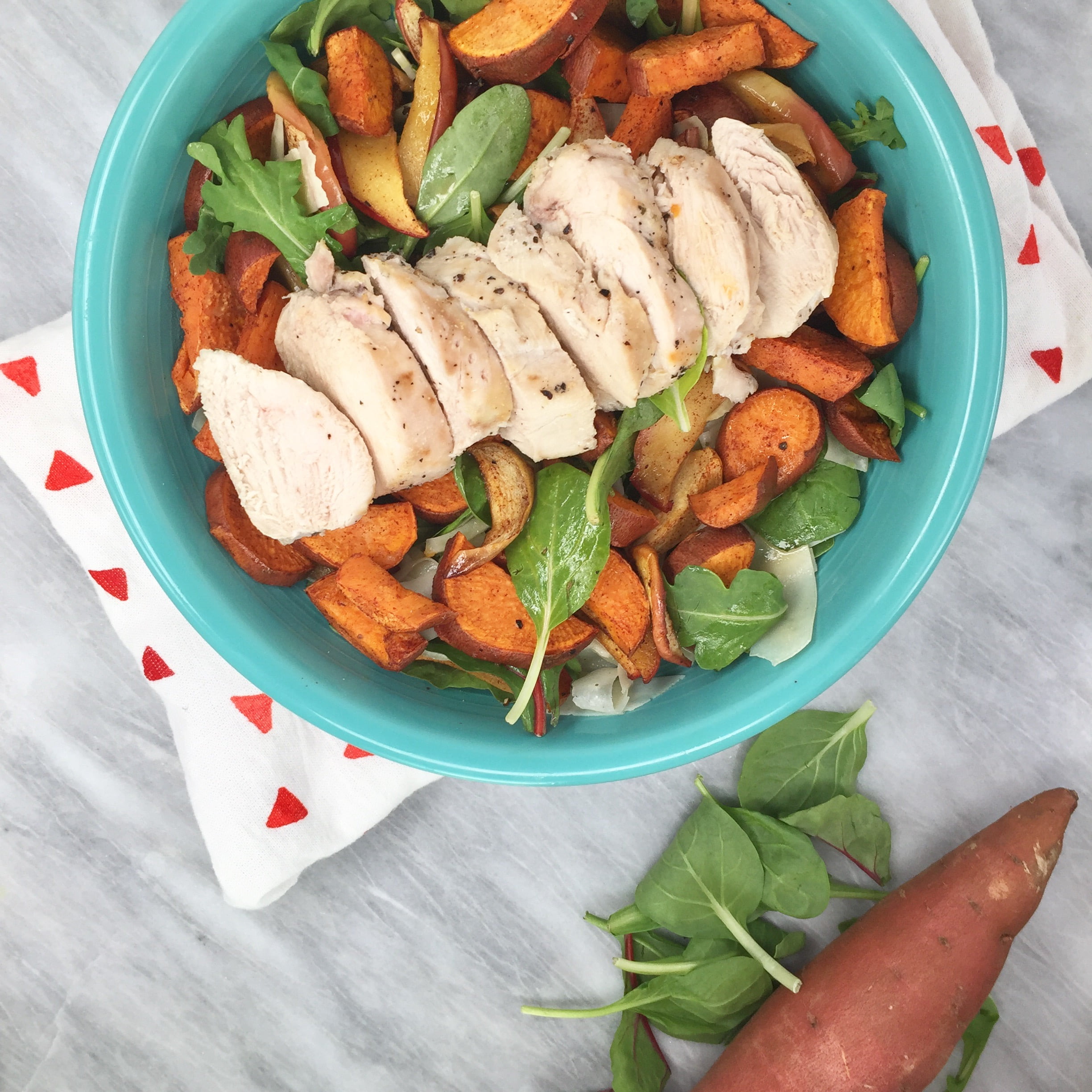 Easy Autumn salad on a marble background.