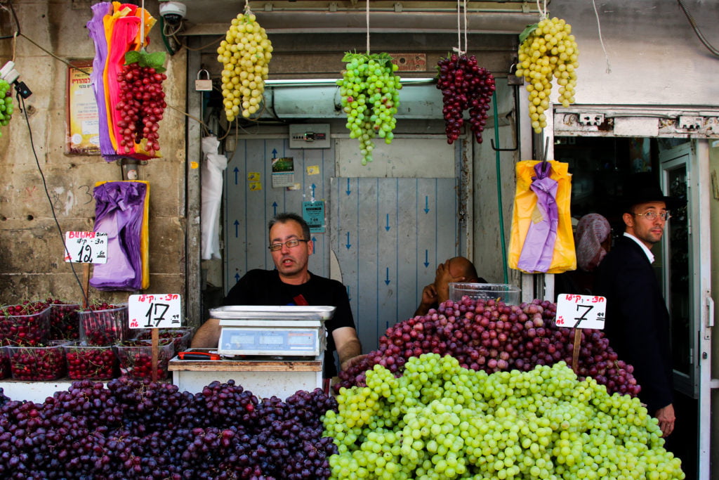 Grapes hanging from a stall at Mahane Yehuda market in Jerusalem.