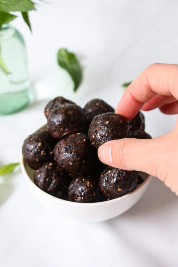 Chocolate-mint truffles made with tahini, dates, oats and cocoa powder.